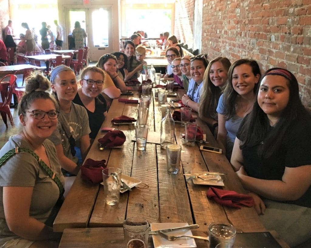 Students at dining table during campus retreat