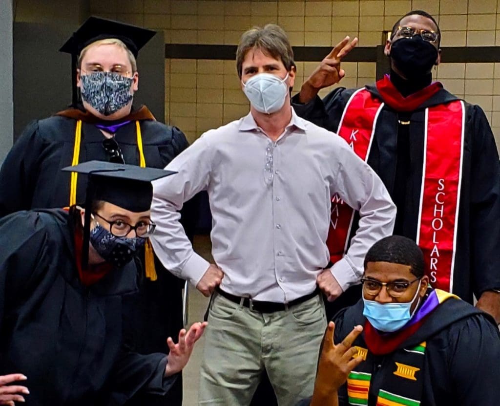 Associate Ben Pascoe with four of his communications students