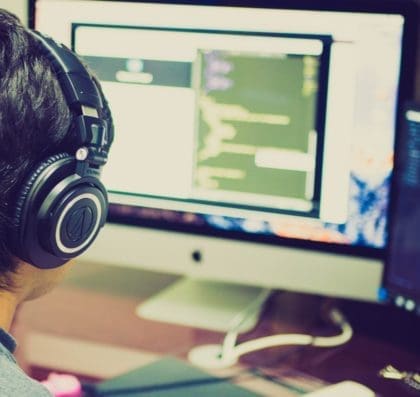 Student programming student at his workstation